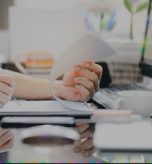 cropped-shot-man-hand-using-pencil-writing-clipboard-while-sitting-office-desk-working-with-computer_44344-1284